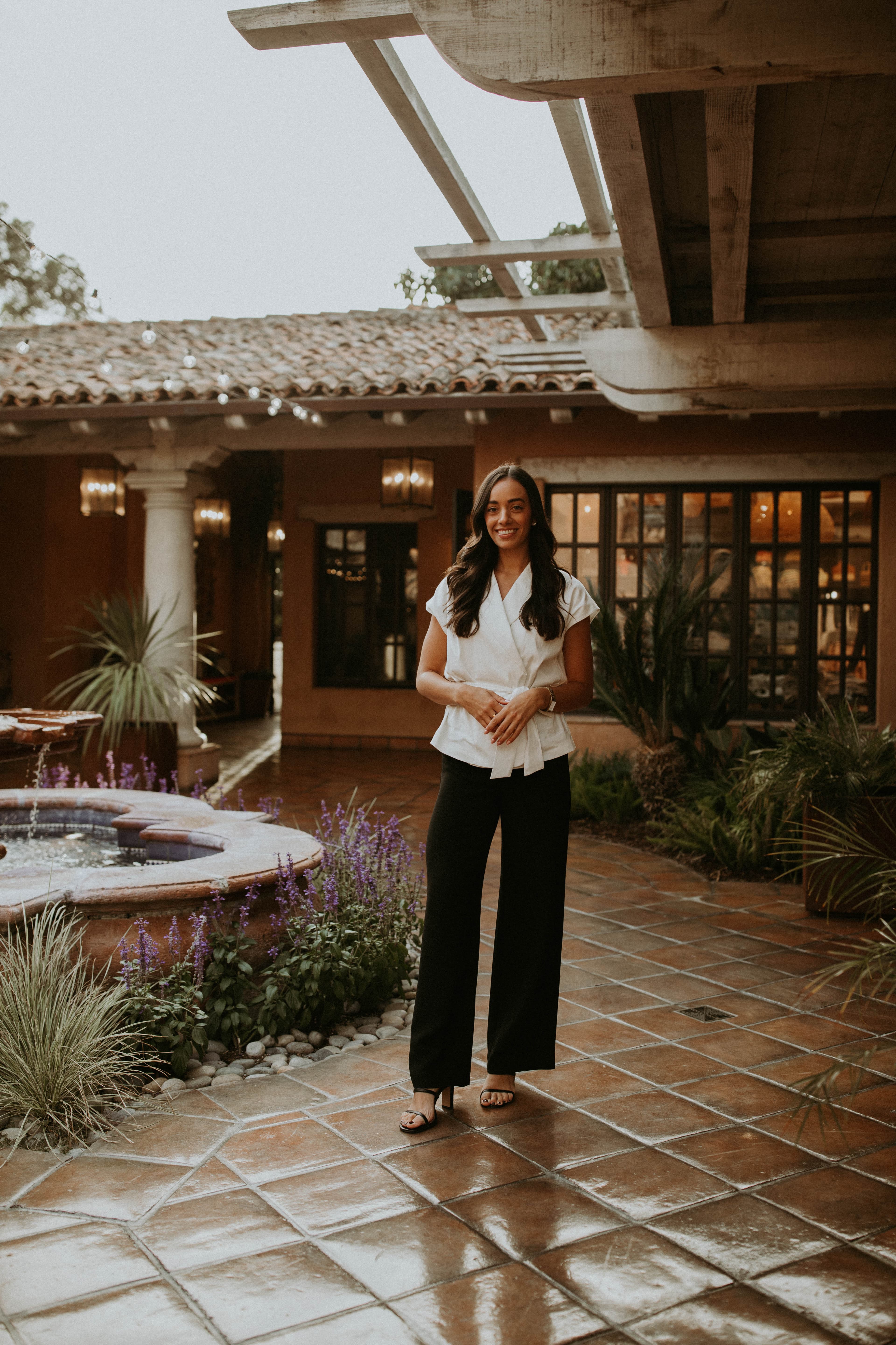 Sarah in a courtyard